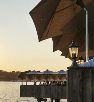 Sunset view from Fischerstube's lakeside terrace on Lake Zurich.