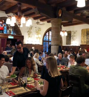Bustling dining room inside Zeughauskeller in Zurich.