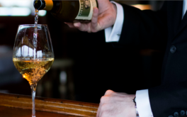 man pouring wine